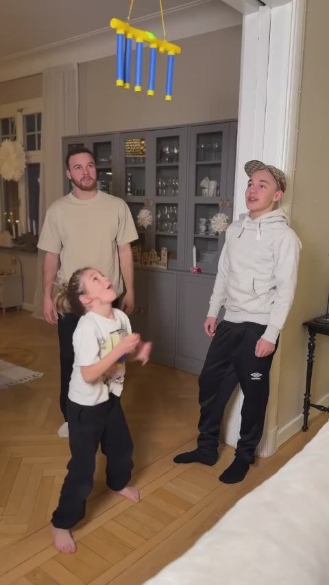 A family plays the Kiddio Reflex Game together at Christmas